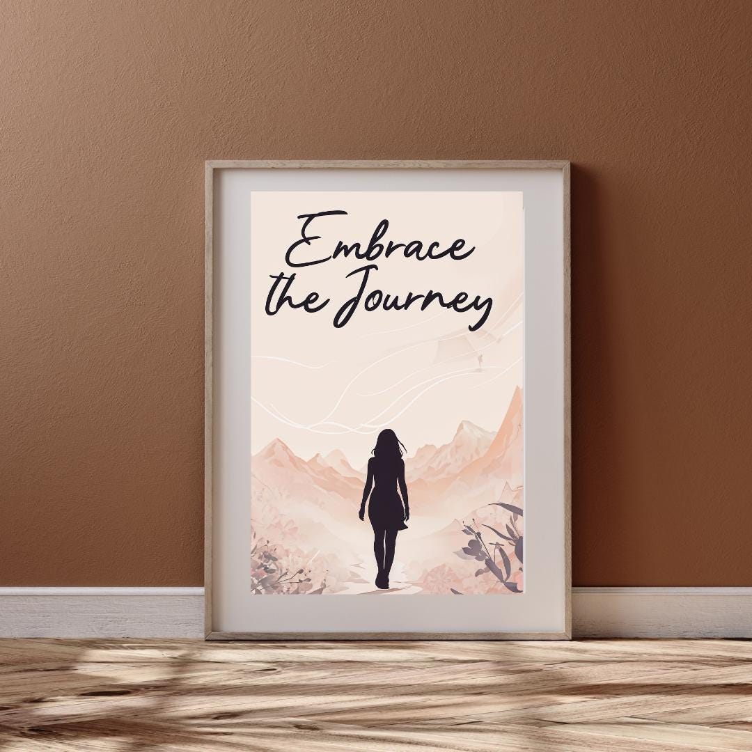 Minimalist poster with the words "Embrace the Journey" in elegant script, featuring the silhouette of a woman walking through a serene mountain landscape in soft, neutral tones. A motivational feminine design symbolizing resilience and discovery.